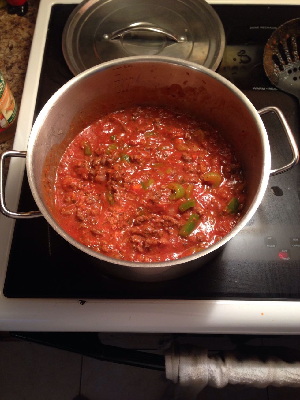 Mix and let simmer with the lid on until the sauce starts to bubble.