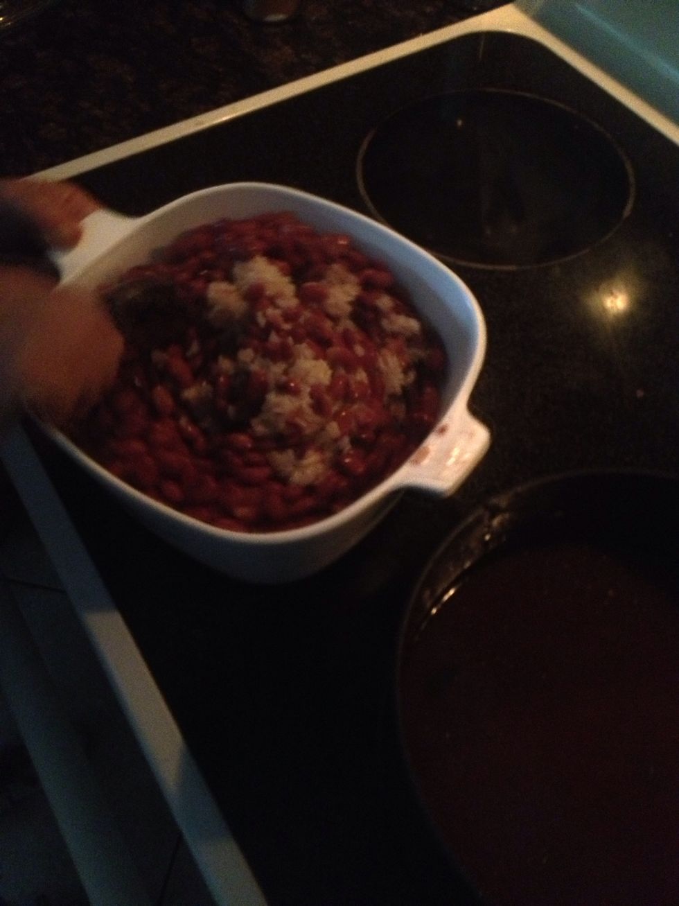 Mix beans and bean water into rice. Let sit until water gets soaked up.