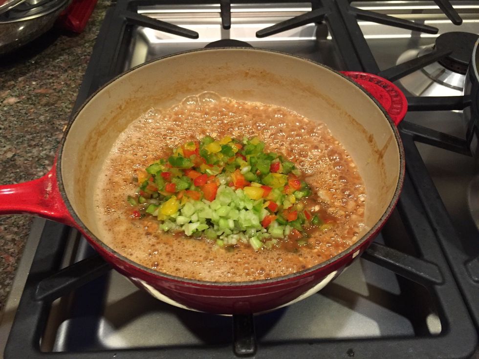 Mix bell pepper/celery mixture into Roux and onion mixture in pot and pull off of the heat to cool