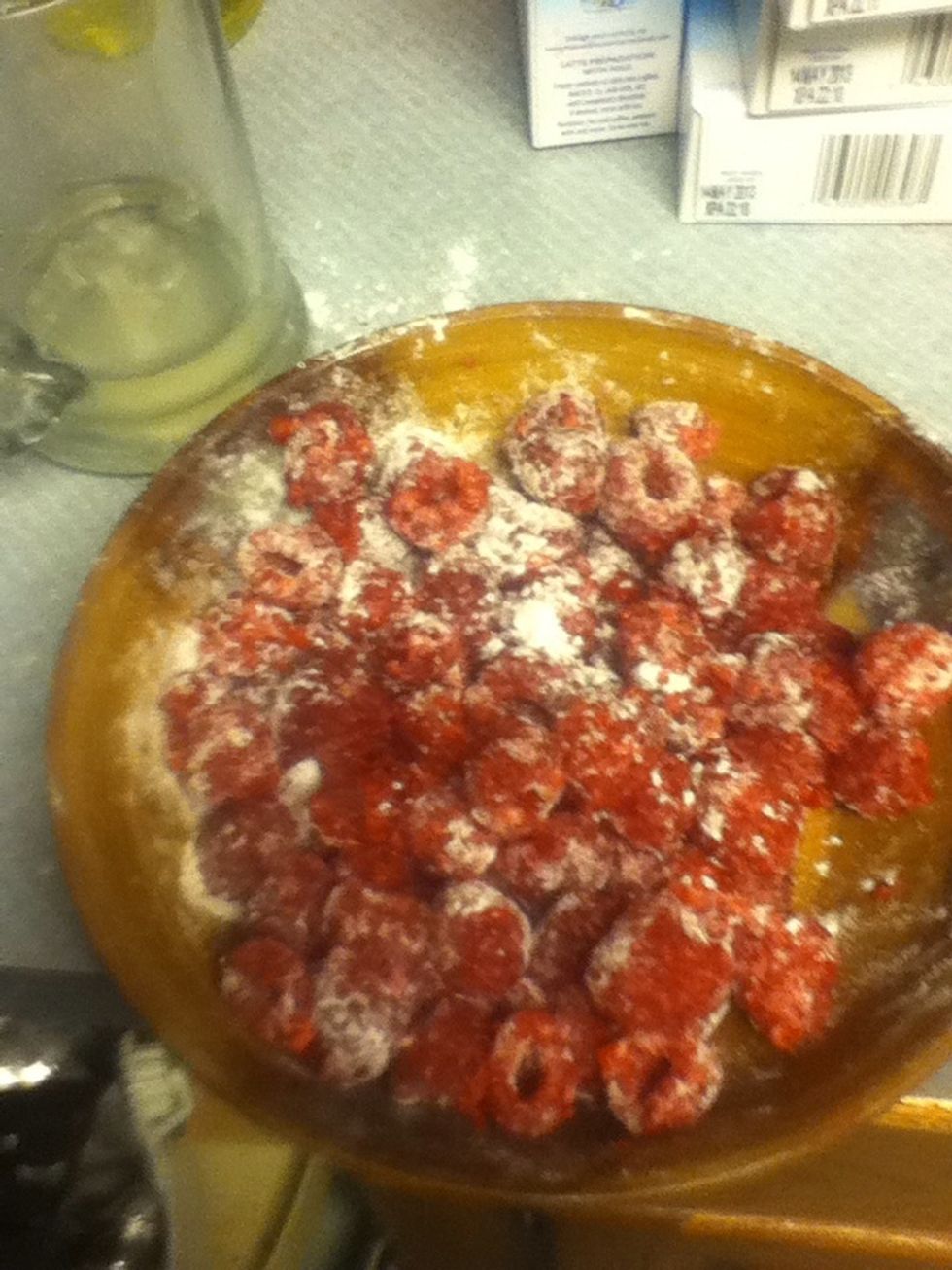 Mix berries in flour.