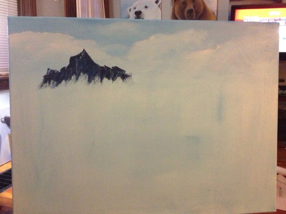 Mix blue and crimson together to get a deep purple. Add some to your palette knife and start your mountain range with vertical scrapes.