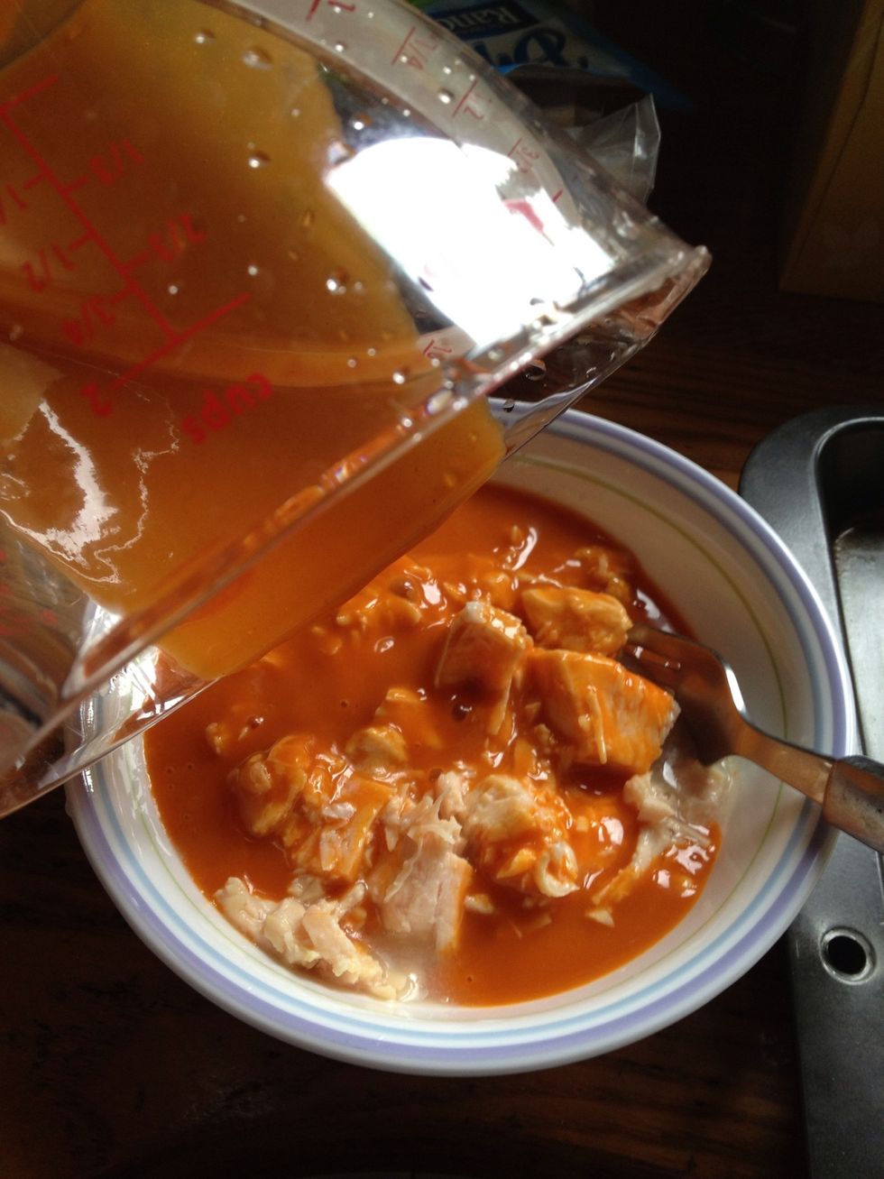 Mix buffalo wing sauce and chicken together.