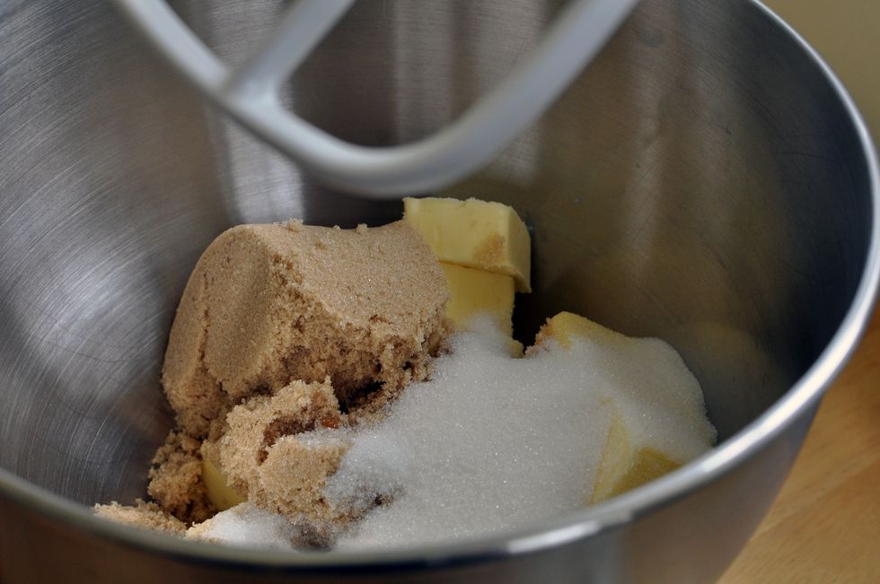 mix butter and brown sugar together and lay out evenly on an 8-inch pan, then place pineapple rings on pan evenly spaced with cherries in the middles of the rings