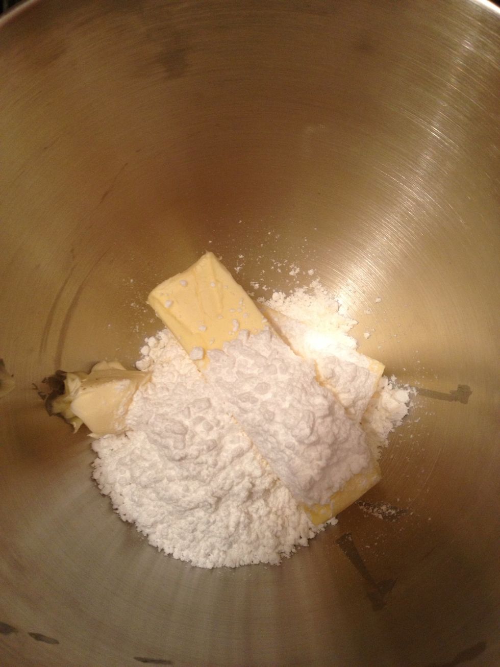 Mix butter and powdered sugar together in a mixer.