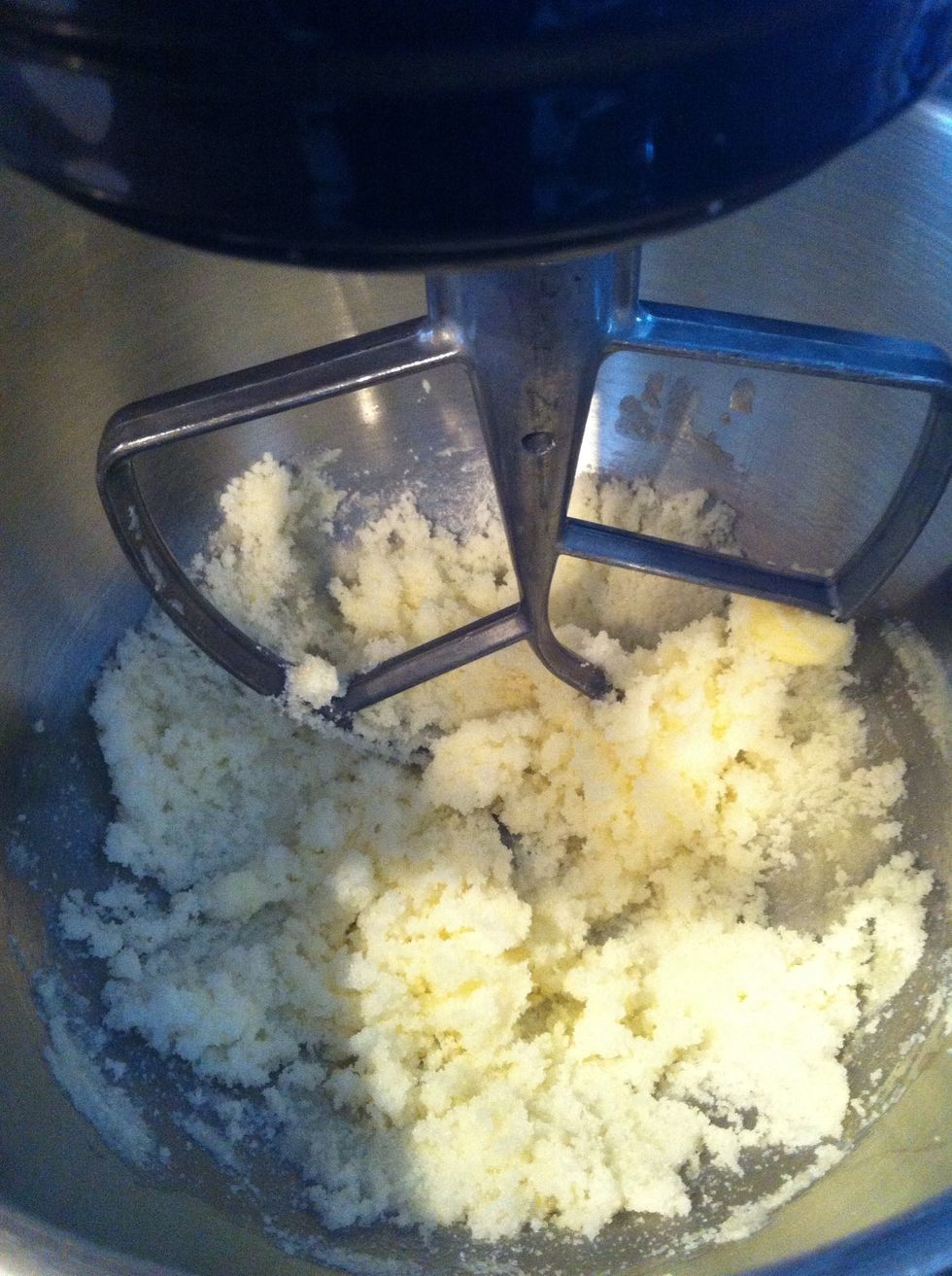 Mix butter and sugar together with electric mixer