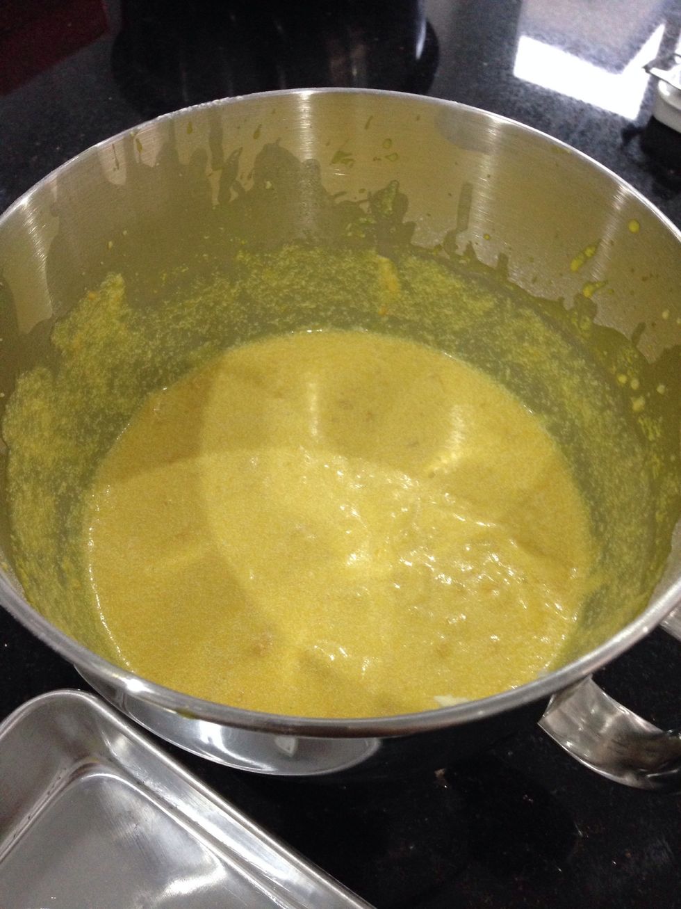 Mix butter and sugar with eggs then beat them. Add the dry ingredient. Lastly pour down the cup of milk, essence of vanilla and add in the cream corn lastly add yellow colouring to the mixture.