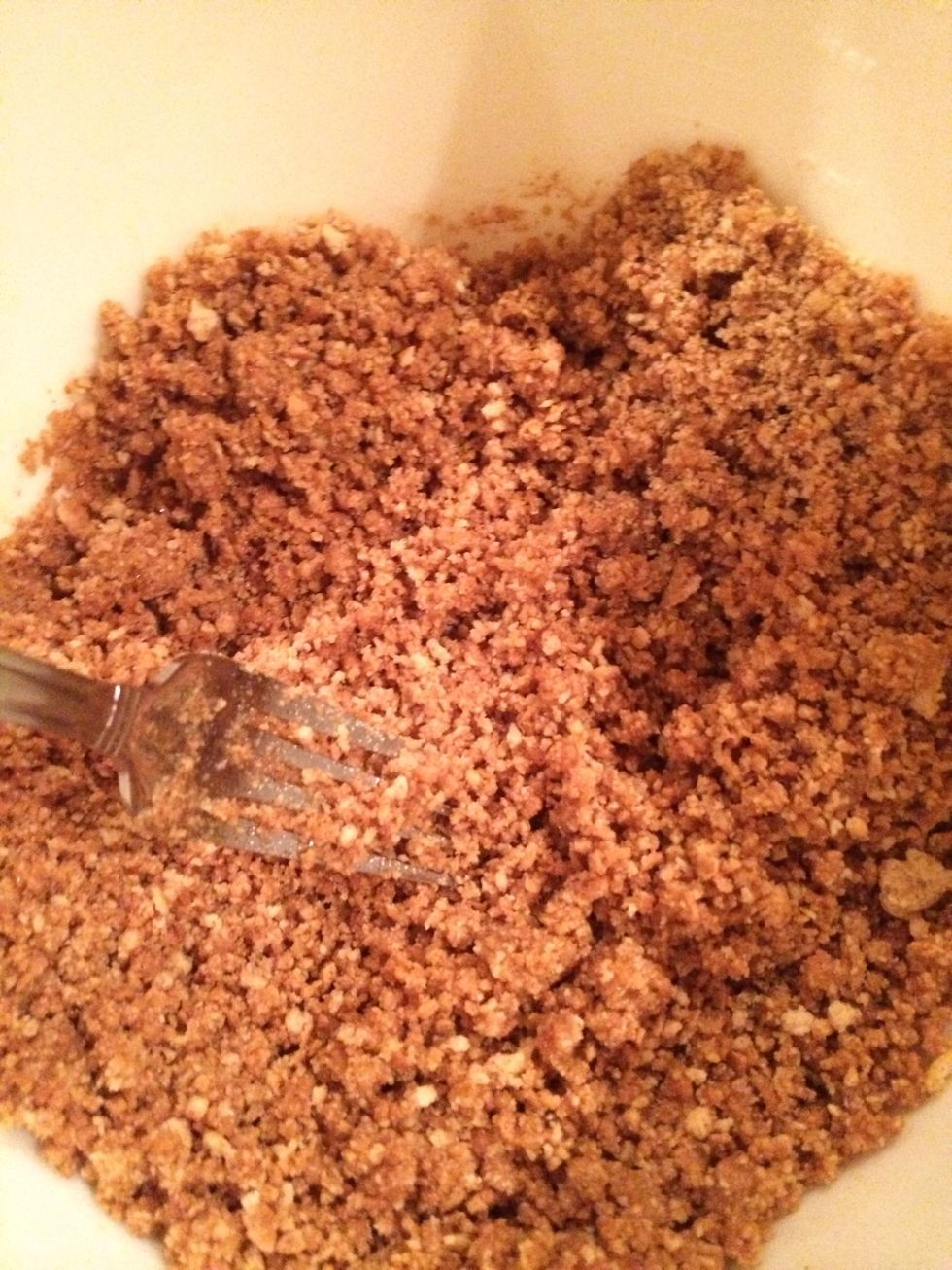 Mix butter into ground graham crackers