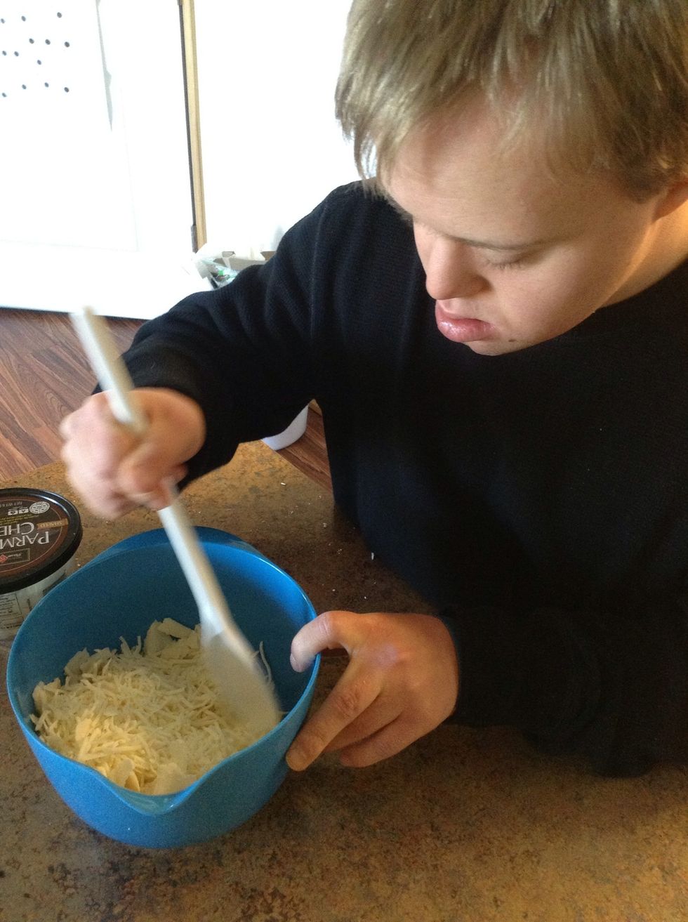 Mix cheeses together using a spoon