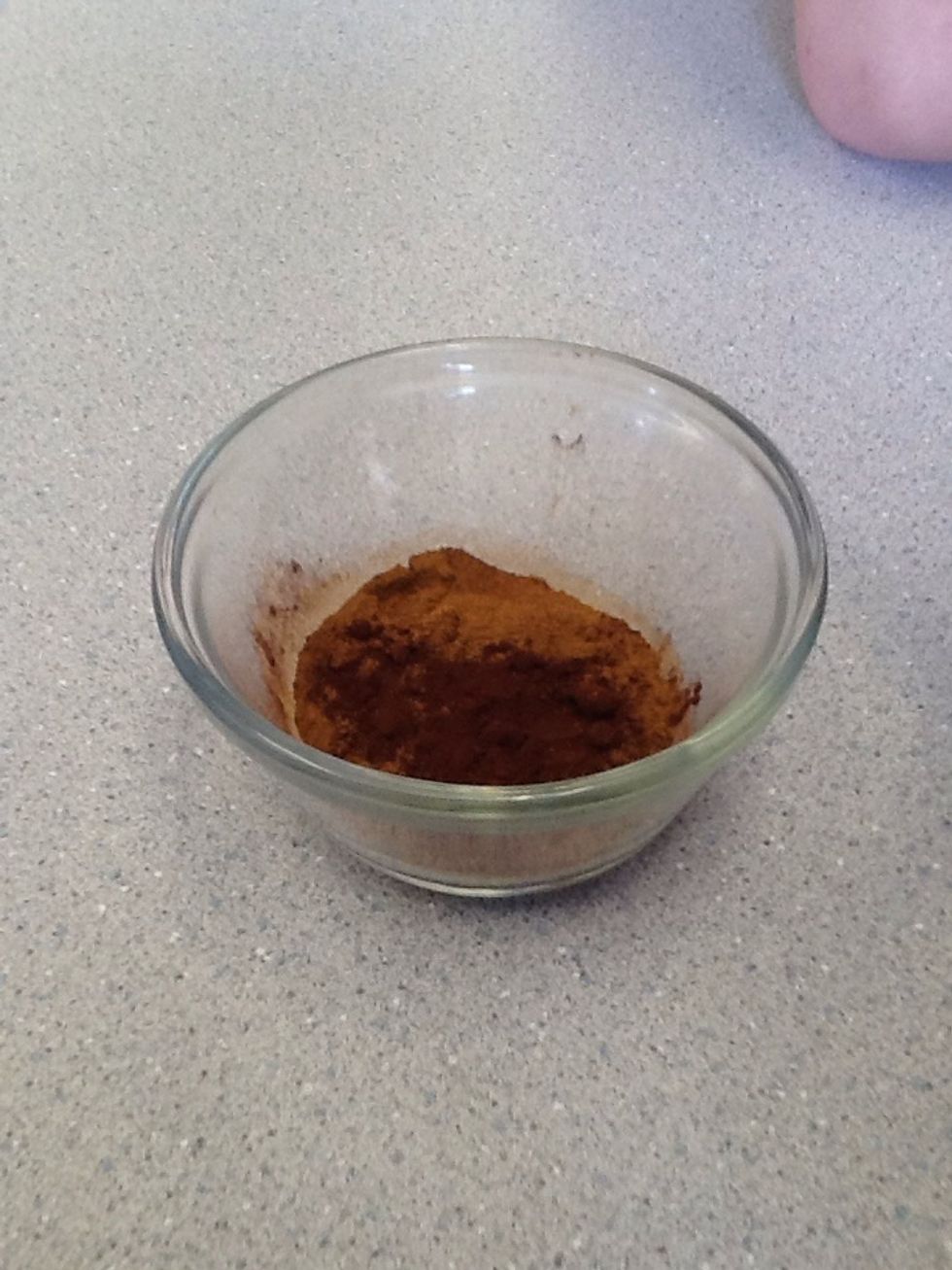 Mix cocoa and cinnamon in a custard cup.