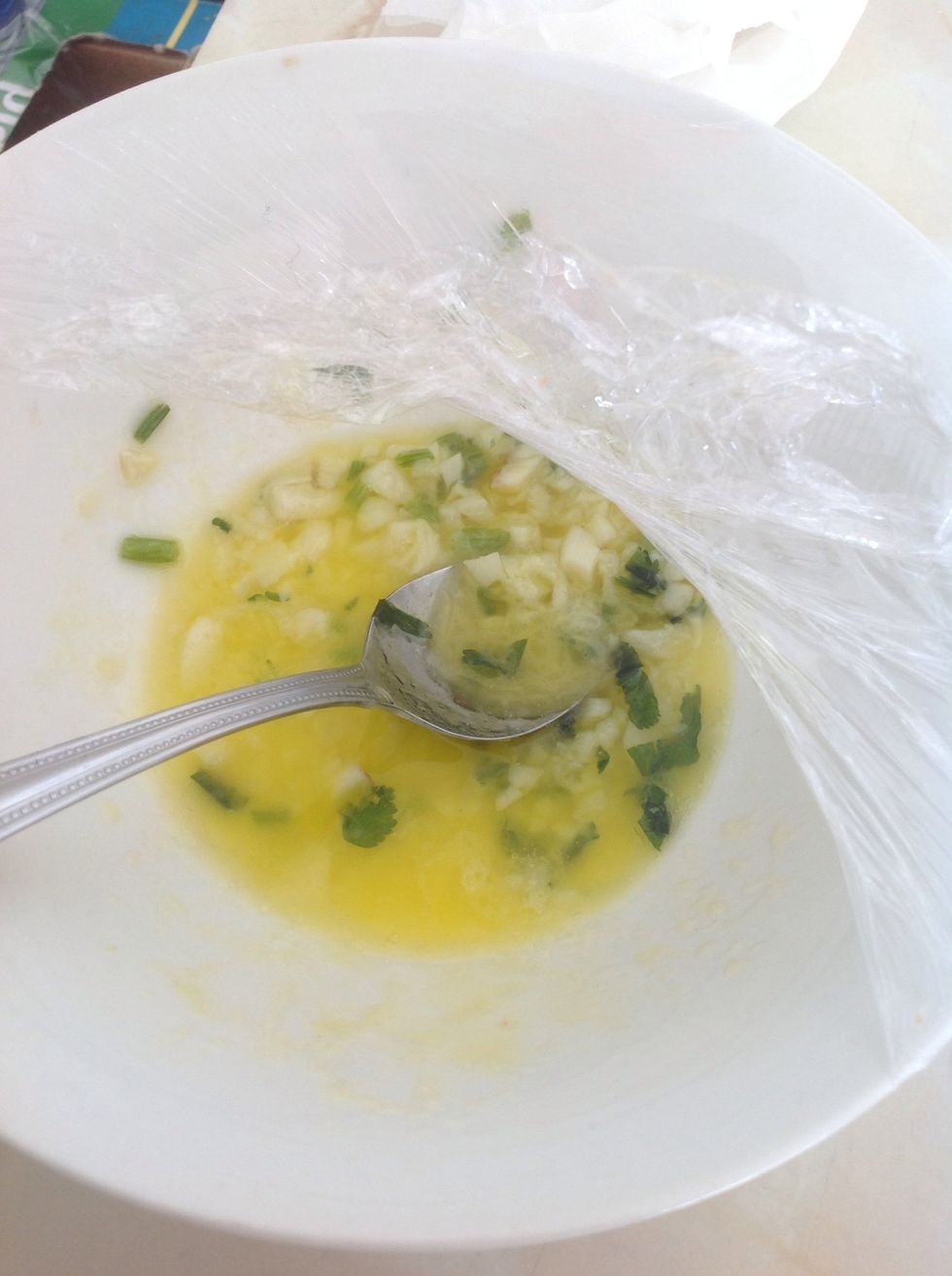 Mix coriander, garlic and 50 gram of butter, put in the microwave for about 1 mins until it melts down