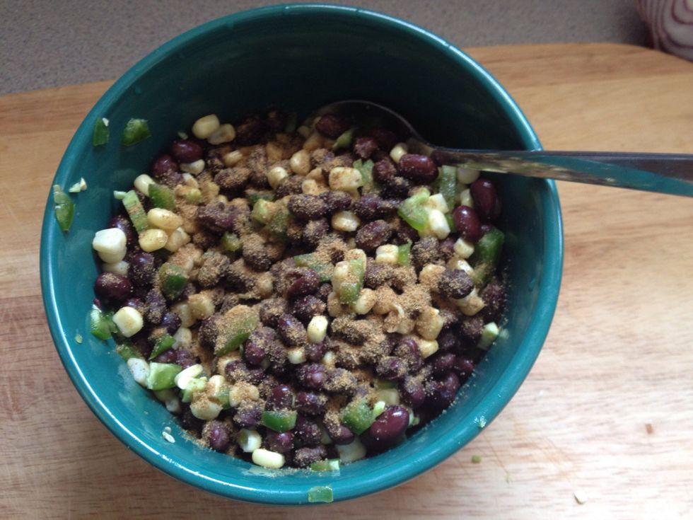 Mix corn, chopped up jalape\u00f1o and beans together, sprinkle with cumin
