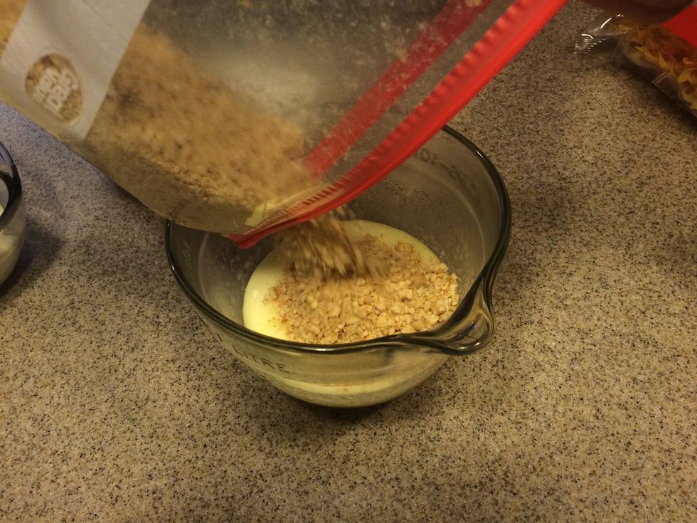 Mix crackers with the melted butter.