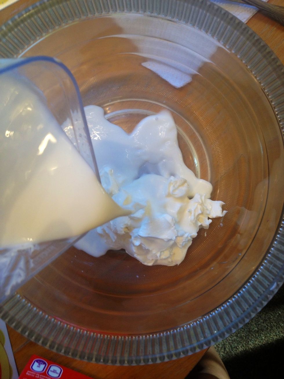Mix cream cheese and milk together in a bowl . Melt the mixture in double boiler. **a boiler filled with boiling water with another bowl with the mixture inside of it. **