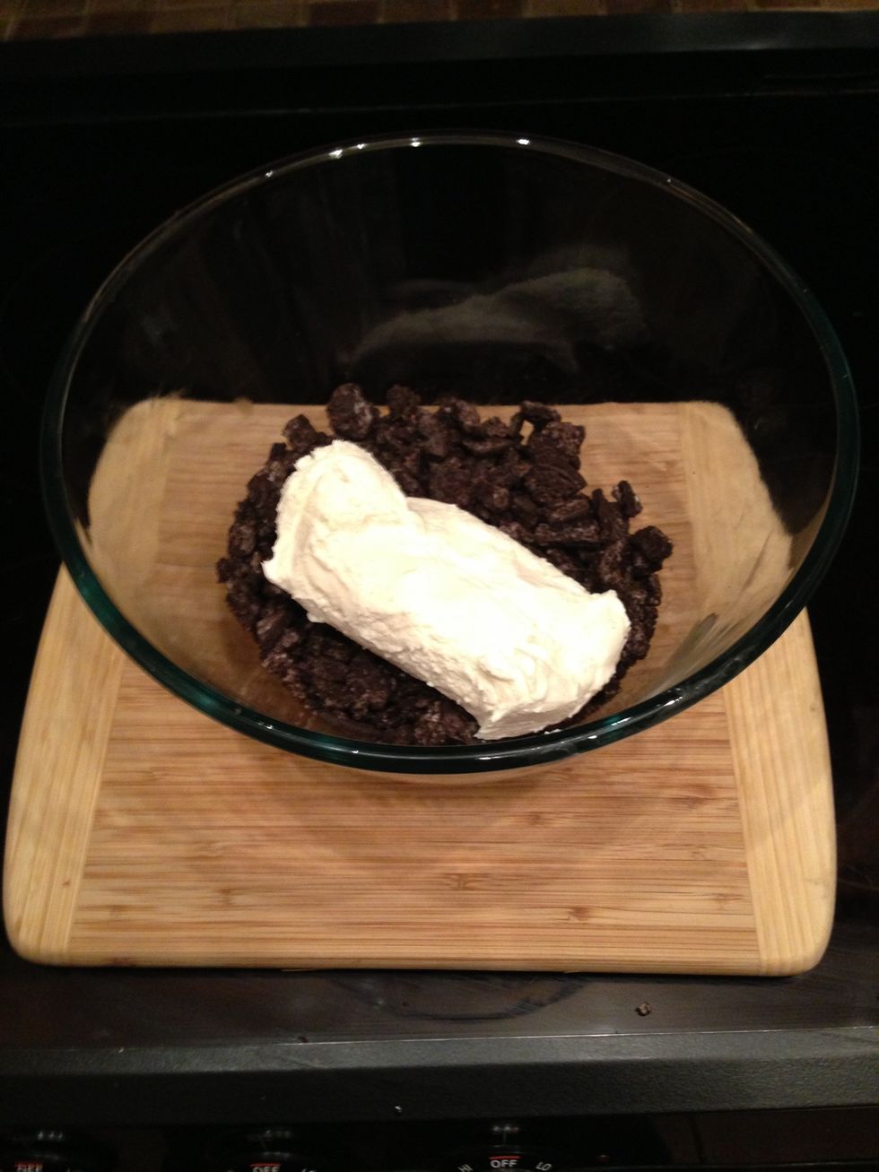 Mix crushed cookies with softened cream cheese
