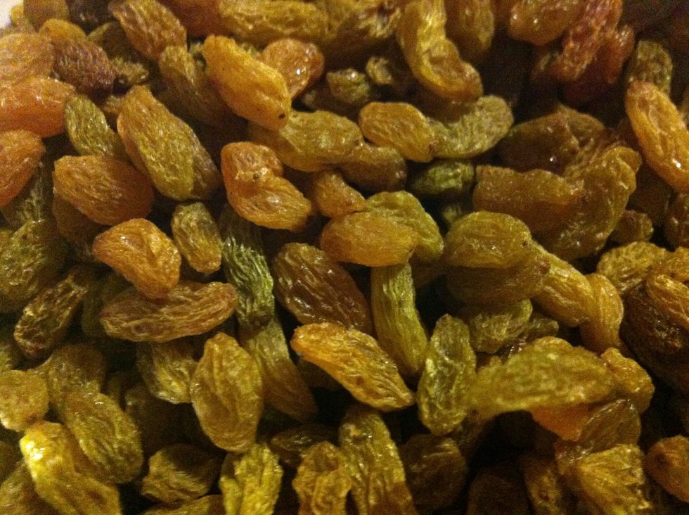 Mix dates and golden raisins in a pan.