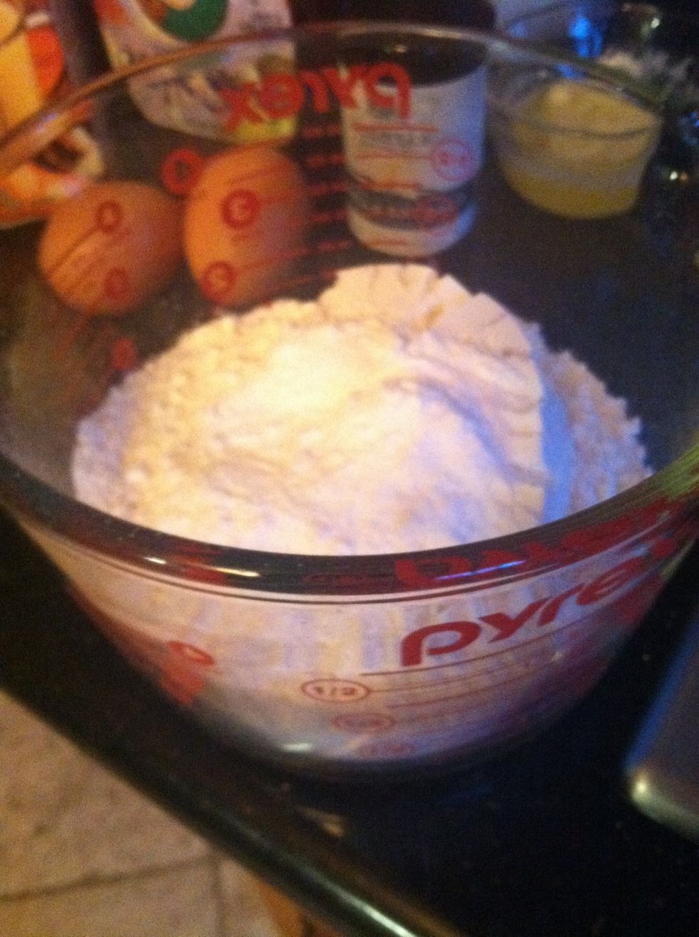 Mix dry ingredients: flour, baking powder, and baking soda, in mixing bowl.