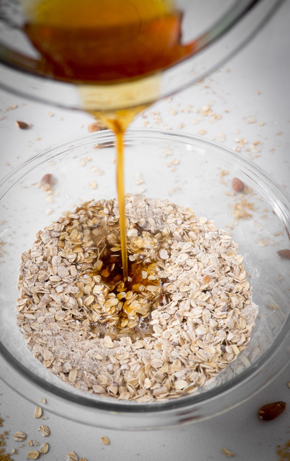 Mix dry ingredients together in a bowl. Microwave coconut oil and honey until melted, then add almond extract. Mix and pour into dry ingredients.