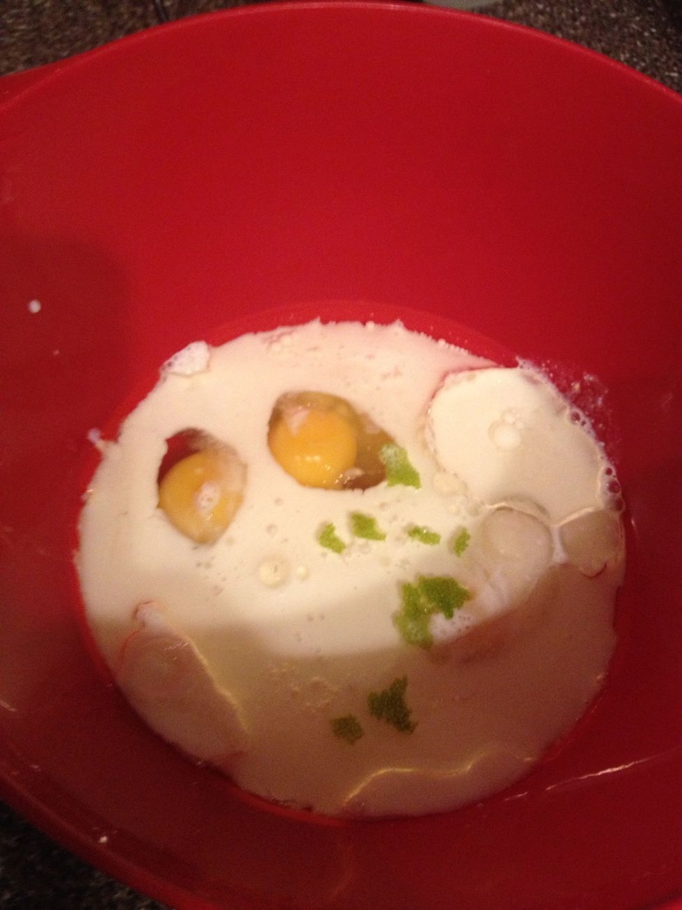 Mix egg, milk, oil, sugar, and lemon peel.