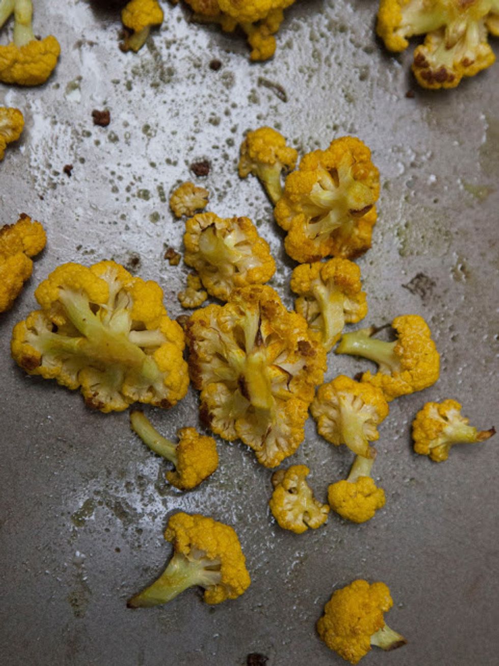 Mix everything around well so the cauliflower is coated. Place it on a baking sheet and pop it into the 400 degree oven to roast for about 20 minutes.