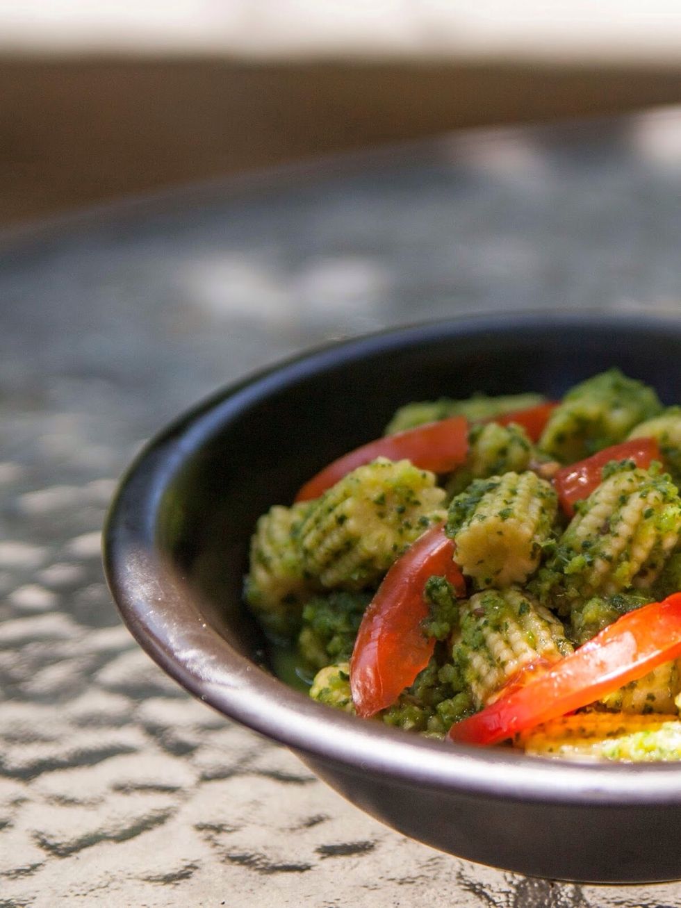 Mix everything together wel.l Sprinkle a bit of tomato strips over the dish and serve it up hot and spicy.