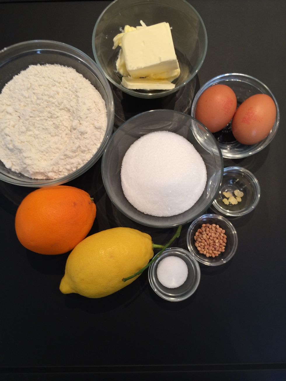 Mix Flour, sugar,mahleb, mastica, salt, orange zest and lemon zest. melt the butter when cold add to lightly beaten eggs. Then add to the milk butter. Now add the liquid to the flour. Knead 5 mins