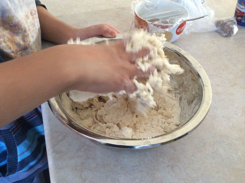 Mix flour with your hands until it becomes one piece