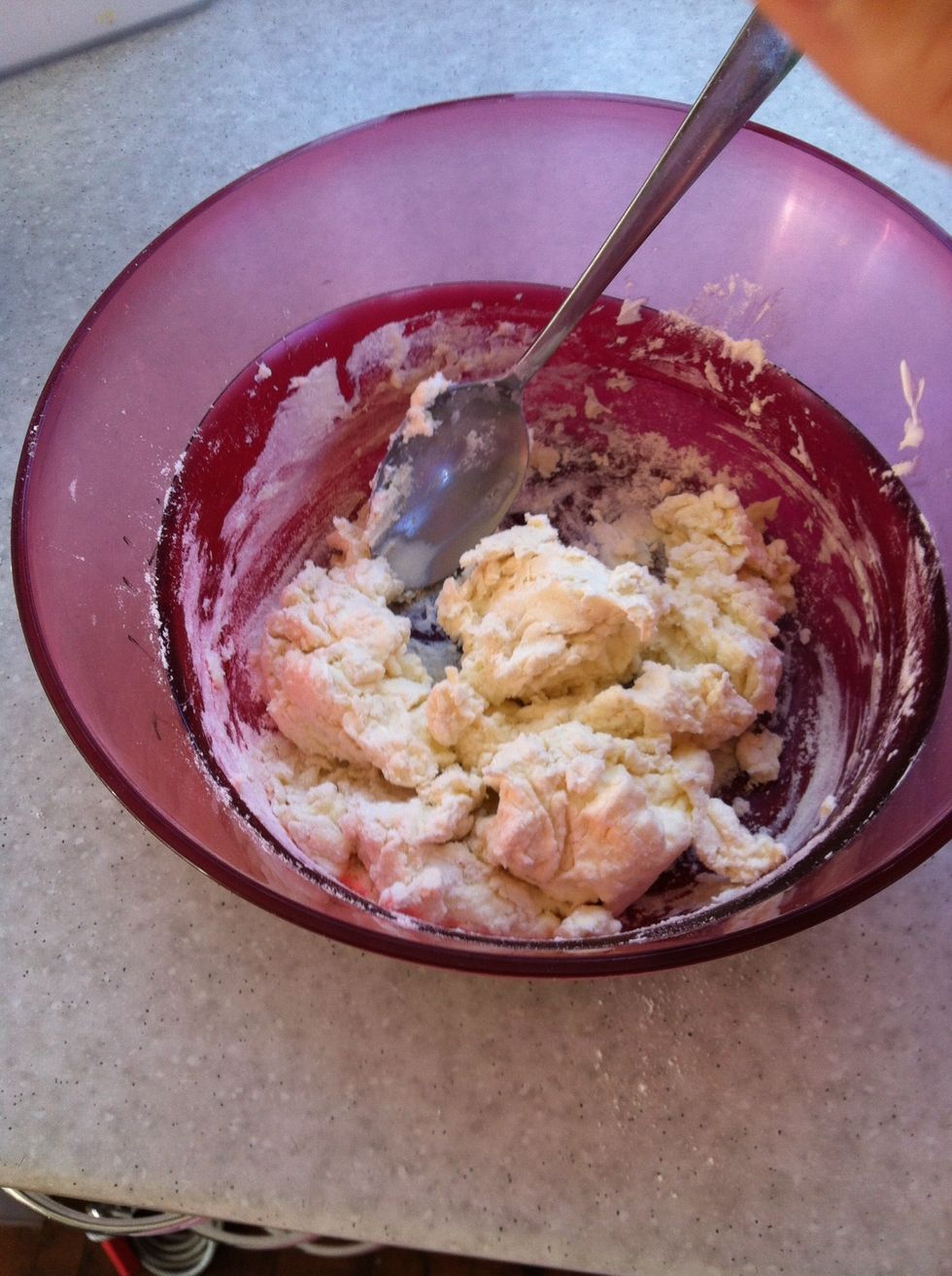 Mix Greek yogurt and flour until it turns into a pizza like consistency. Make as much or as little as you like.