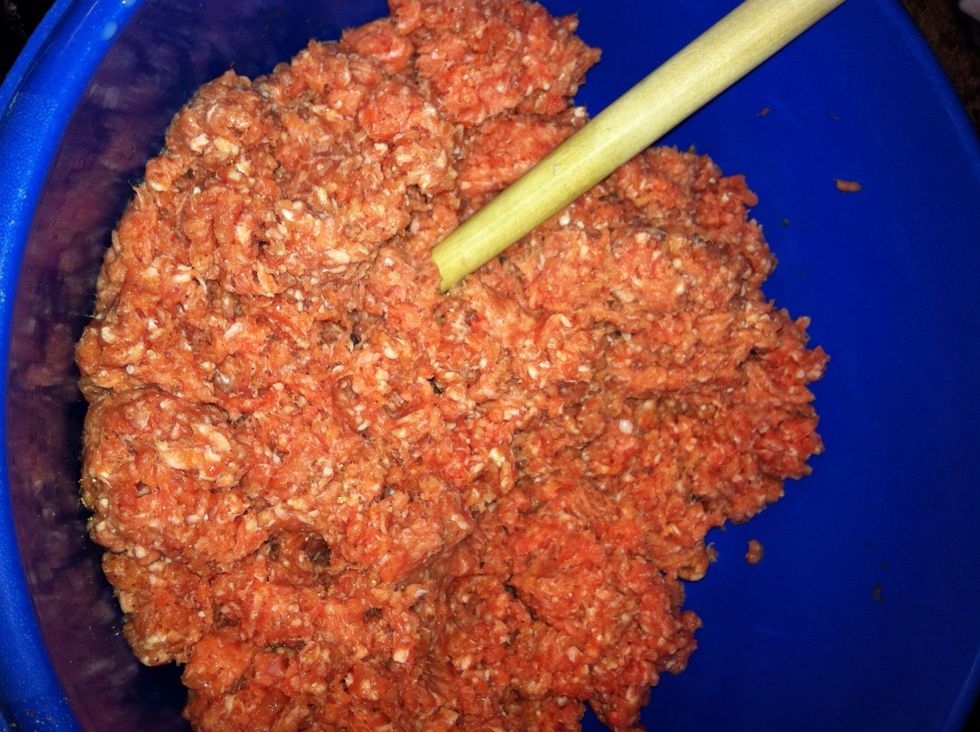 mix ground meats until well combined. Use a mixer or spoon so you don't warm up the mix and melt the fat