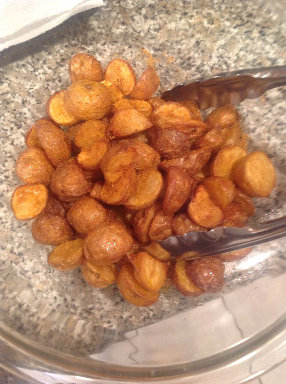 Mix in a bowl with your choice of seasoning. Let stand for a minute before serving cuz they're mega hot and a bit of resting time lets them crisp up too.  These have Lawrie's Seasoning Salt on them.