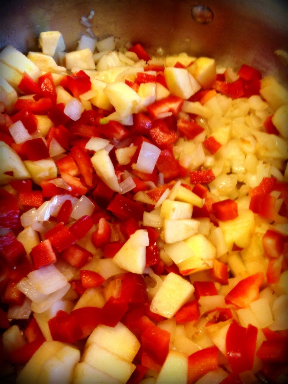 Mix in apples, bell peppers, (and jalape\u00f1o). Cook for a few minutes.