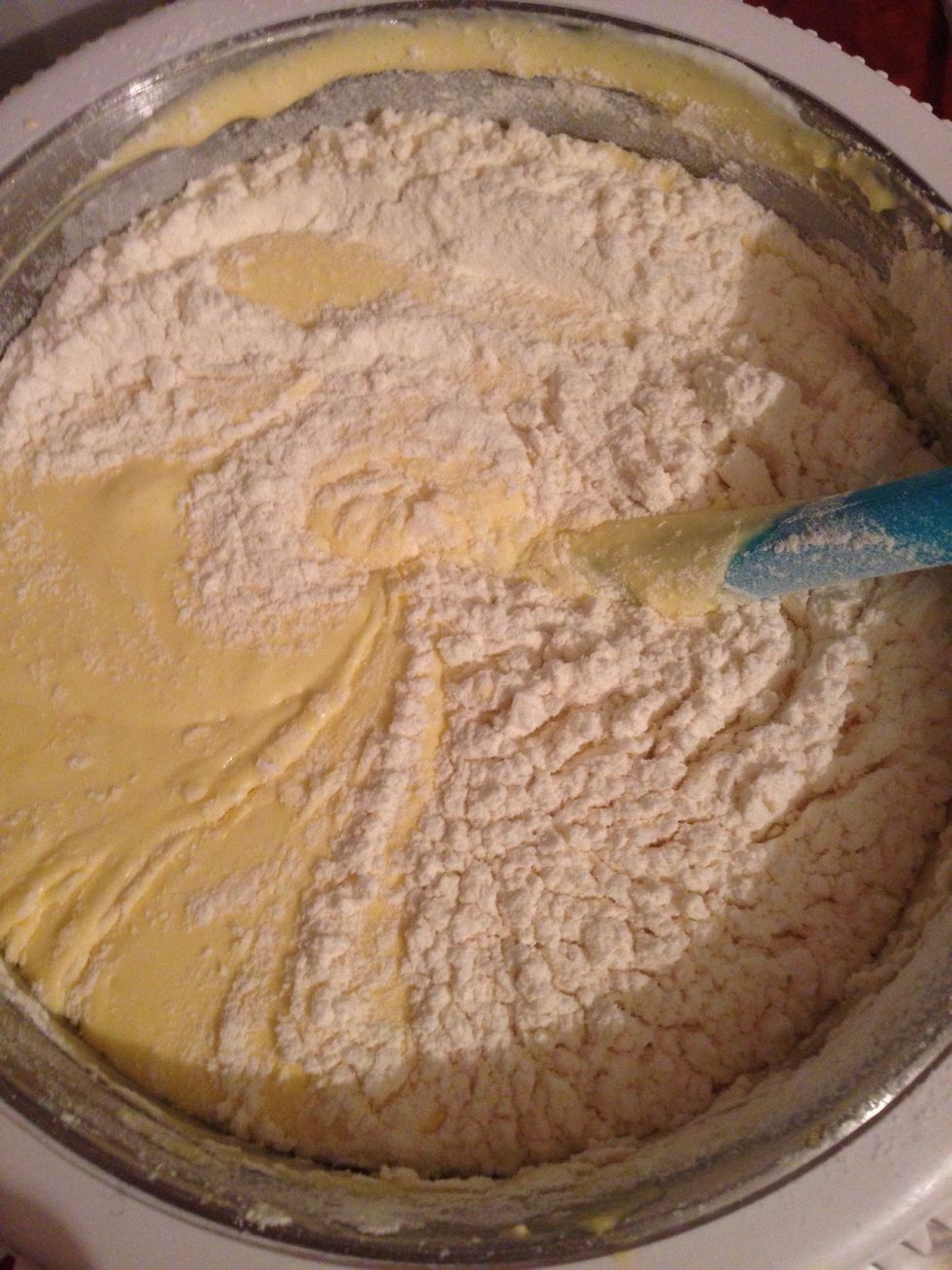 Mix in flour baking powder and vanilla and gently fold