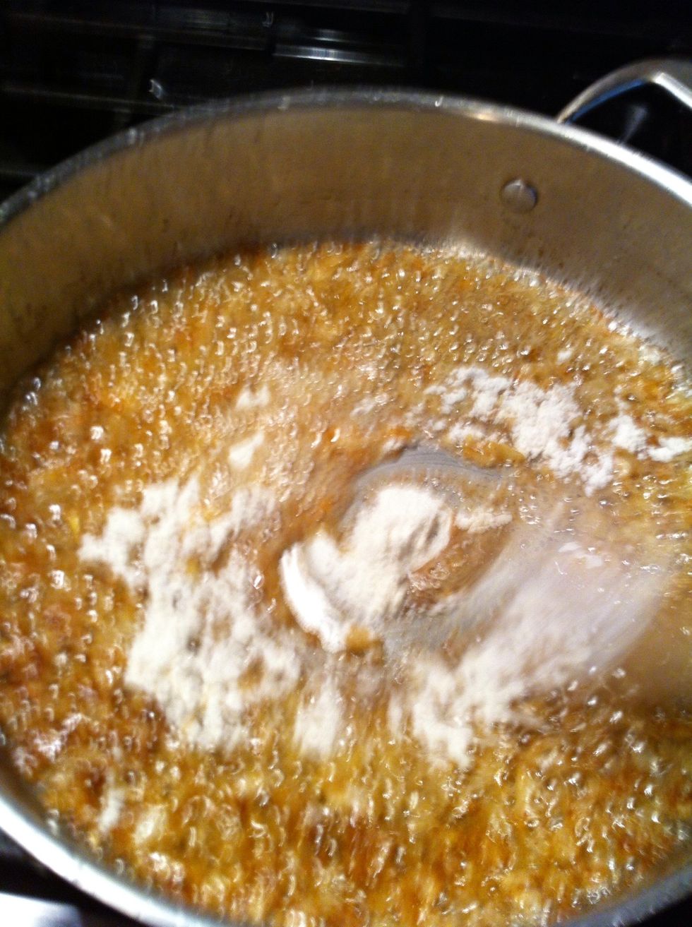 Mix in quickly. Stir constantly. Flour needs to mix and brown too.