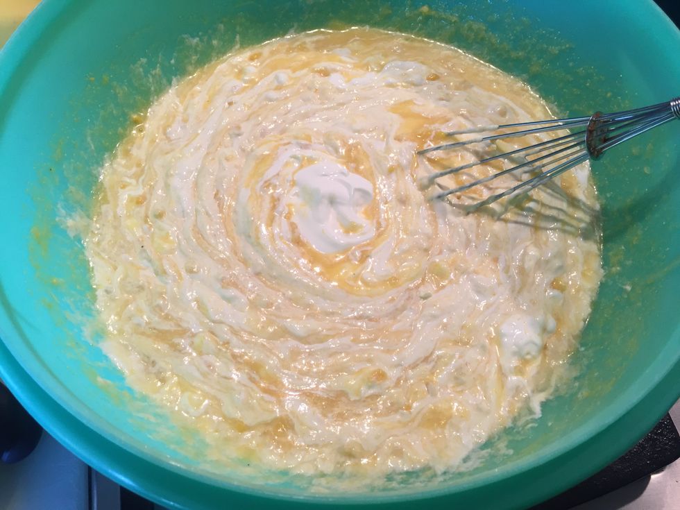 Mix in the 2 cups of sour cream or plain, Greek-style yogurt. Now the stuff gets to be a lighter color of yellow... but it's still yellow.