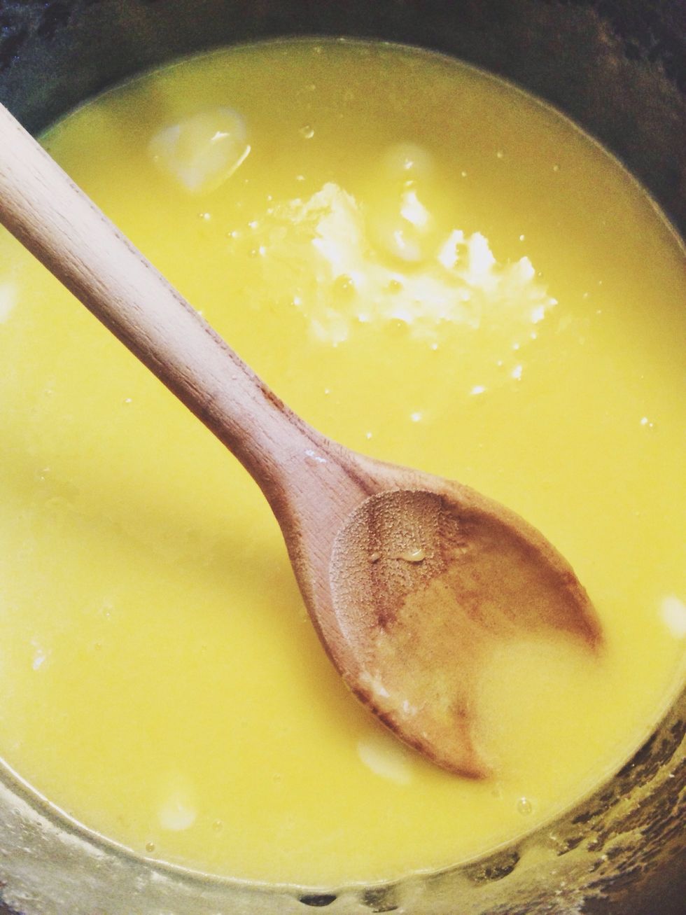 Mix in the butter with a wooden spoon, and then whisk in the heavy cream. Cook over medium heat until the mixture thickens and coats the back of a spoon, 8 to 10 minutes, whisking frequently.