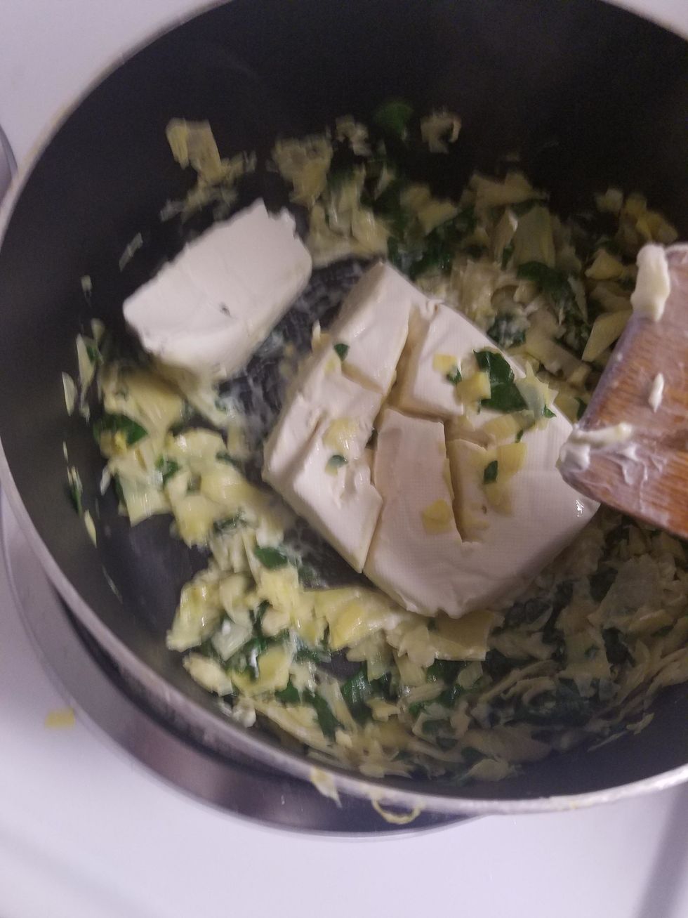 Mix in the cream cheese and mozzarella, and let it melt entirely. Season with salt and pepper to taste.