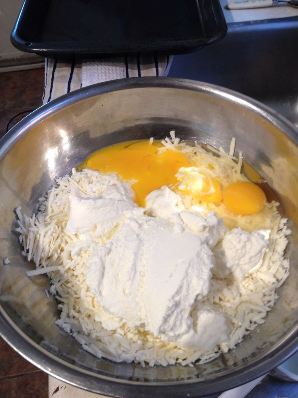 Mix in the feta, ricotta and eggs. Add a bit of pepper. The feta is so salty, no need to add more! Meanwhile, you can heat the butter to a liquid form.
