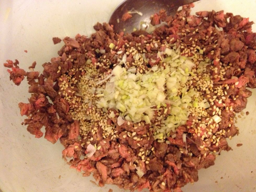 Mix in the nuoc mem, sesame seeds and lemongrass into the meat.