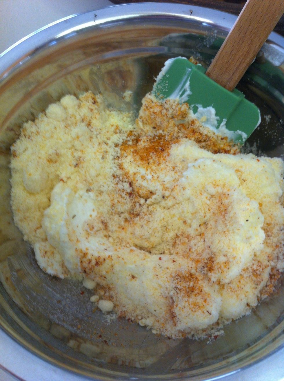 Mix in the yogurt, Parmesean, seasoning, and garlic.