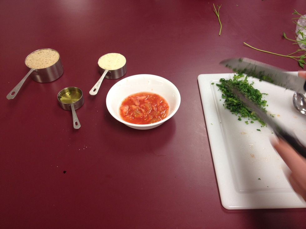 Mix inside layers of onion, tomato seeds and juice, bread crumbs, cheese, parsley, and 1/4 cup of olive oil