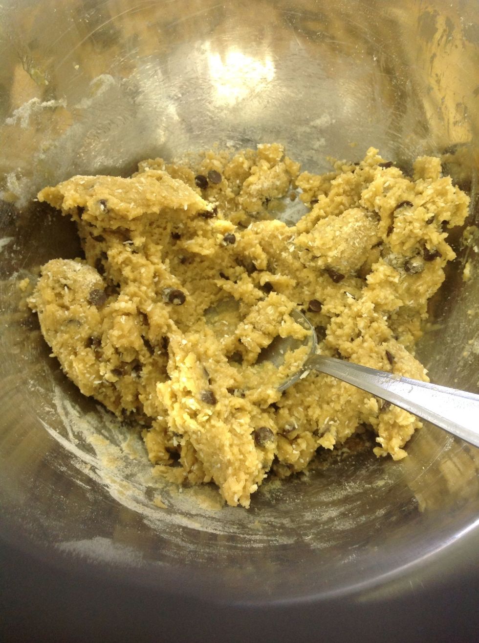 Mix it all together, getting rid of lumps. Line a baking tray with baking paper and squeeze the mixture gently into balls to space evenly apart (if they break, stir the mixture for longer).
