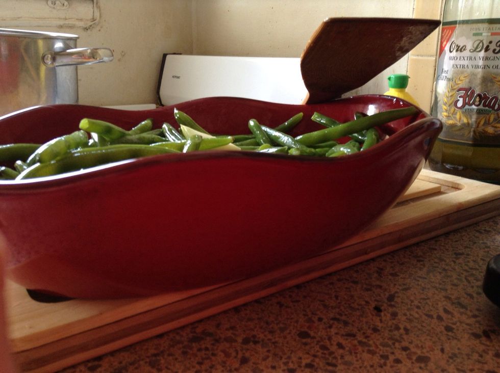 Mix it all together - we have not saut\u00e9ed the garlic, but the heat of the green beans will "cook" it enough to absorb the garlic flavor (you may want to cover with foil to "steam" dish together)