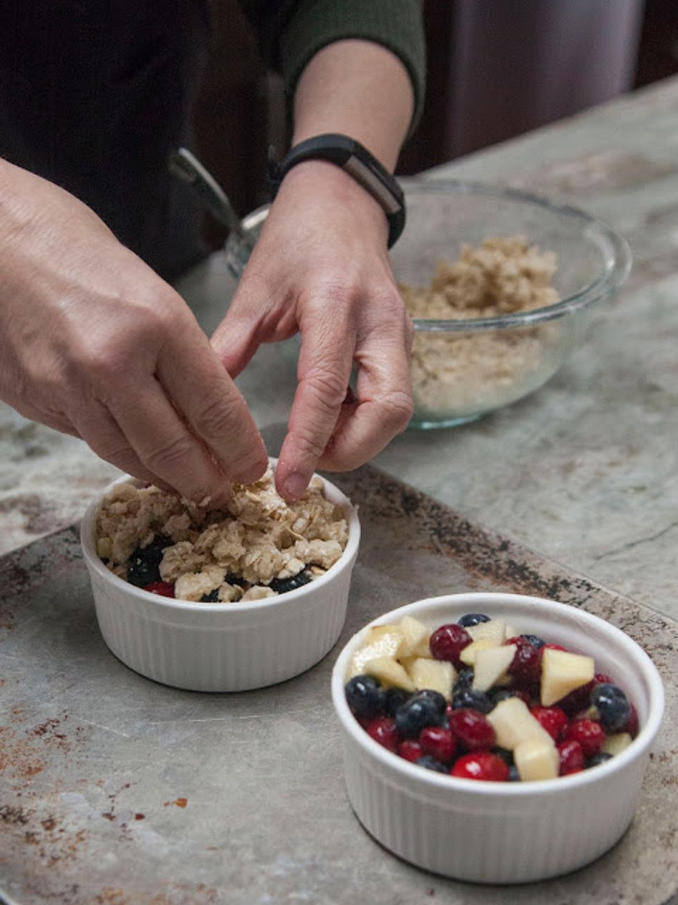 Mix it all together well into crumbly bits and sprinkle the crumbly topping onto the fruit tarts.