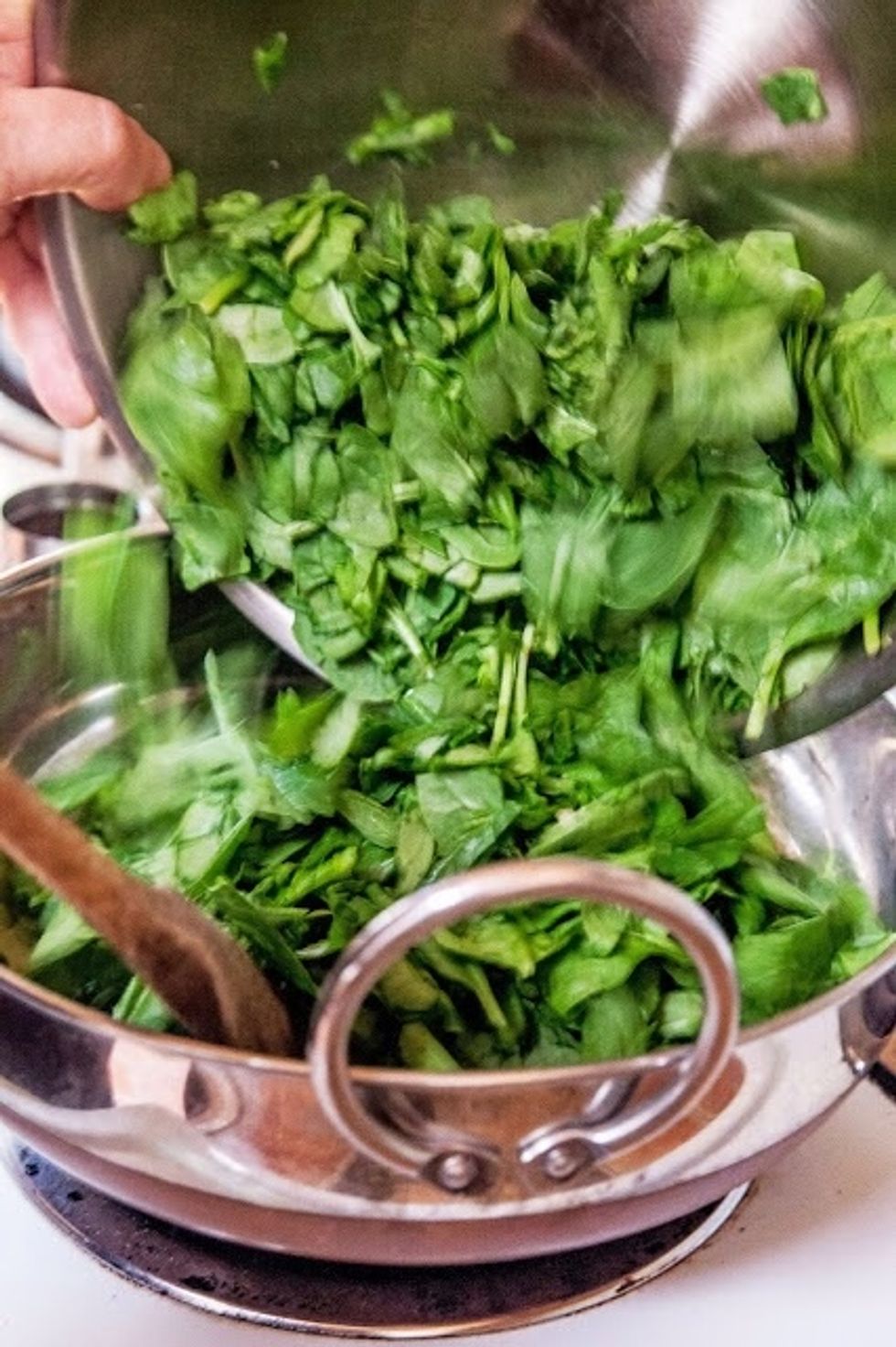Mix it all up, and put the chopped greens into the pan.