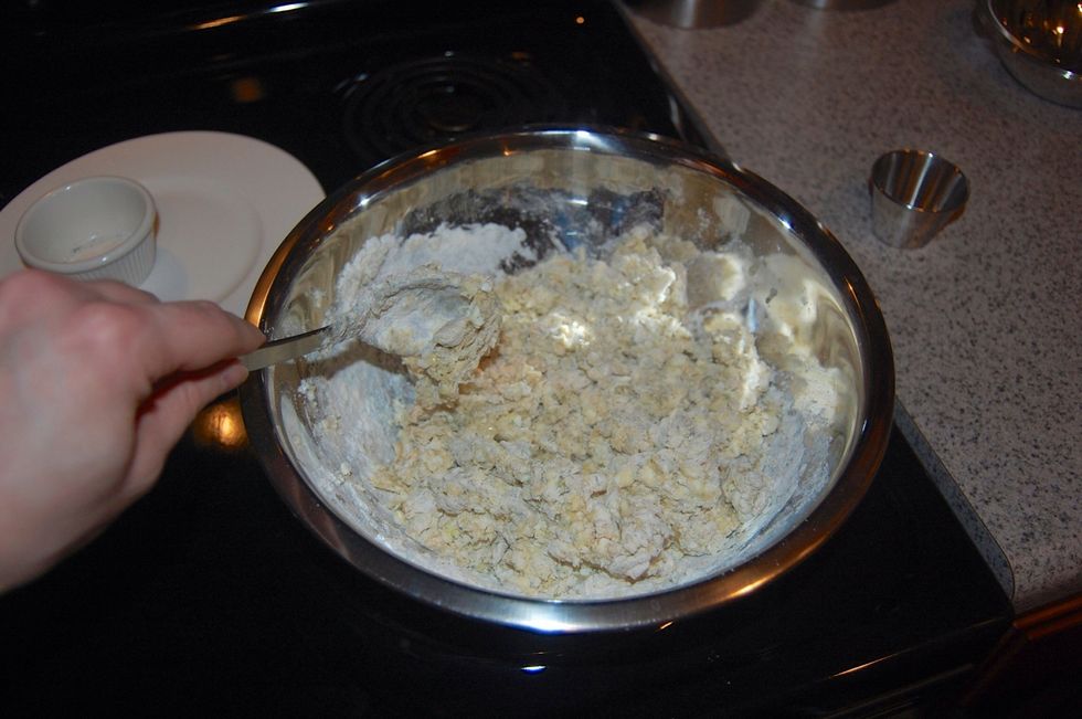 Mix it together. It will get sticky. It doesn't have to be really well mixed because you will knead it next.