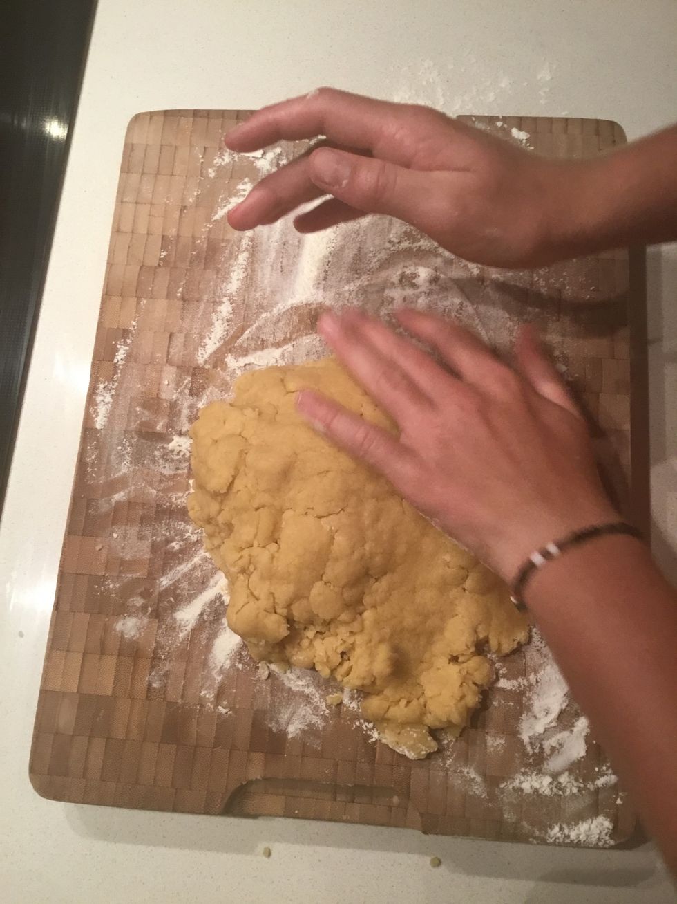 Mix it until it turns into dough then put it onto a rolling board