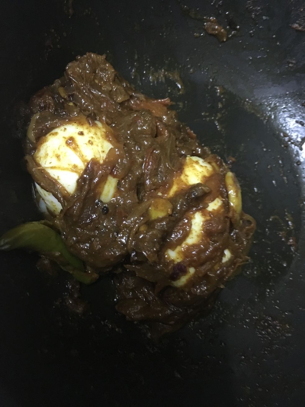 Mix it well and cover the eggs in the masala