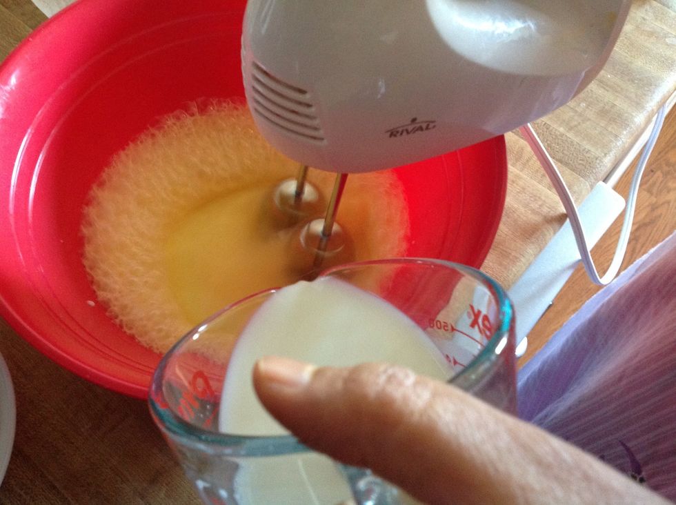 Mix milk, eggs and 1/2 cup sugar in a bowl. Mix till the sugar dissolves.