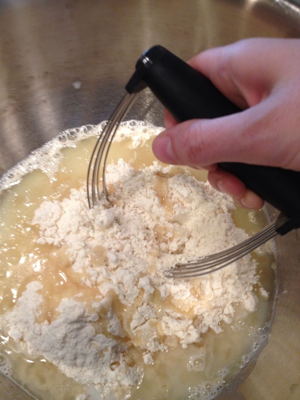 Mix. My go-to tool is a pastry blender, which scrapes the bowl well and gets rid of lumps easily.