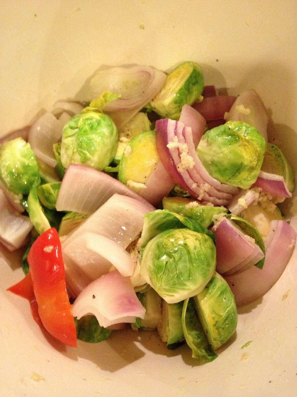 mix olive oil, garlic, salt and pepper and toss with sprouts and onions