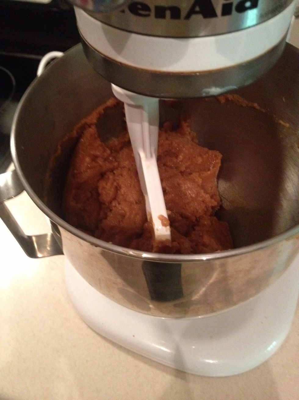 Mix peanut butter, eggs, and sugar in a mixer.